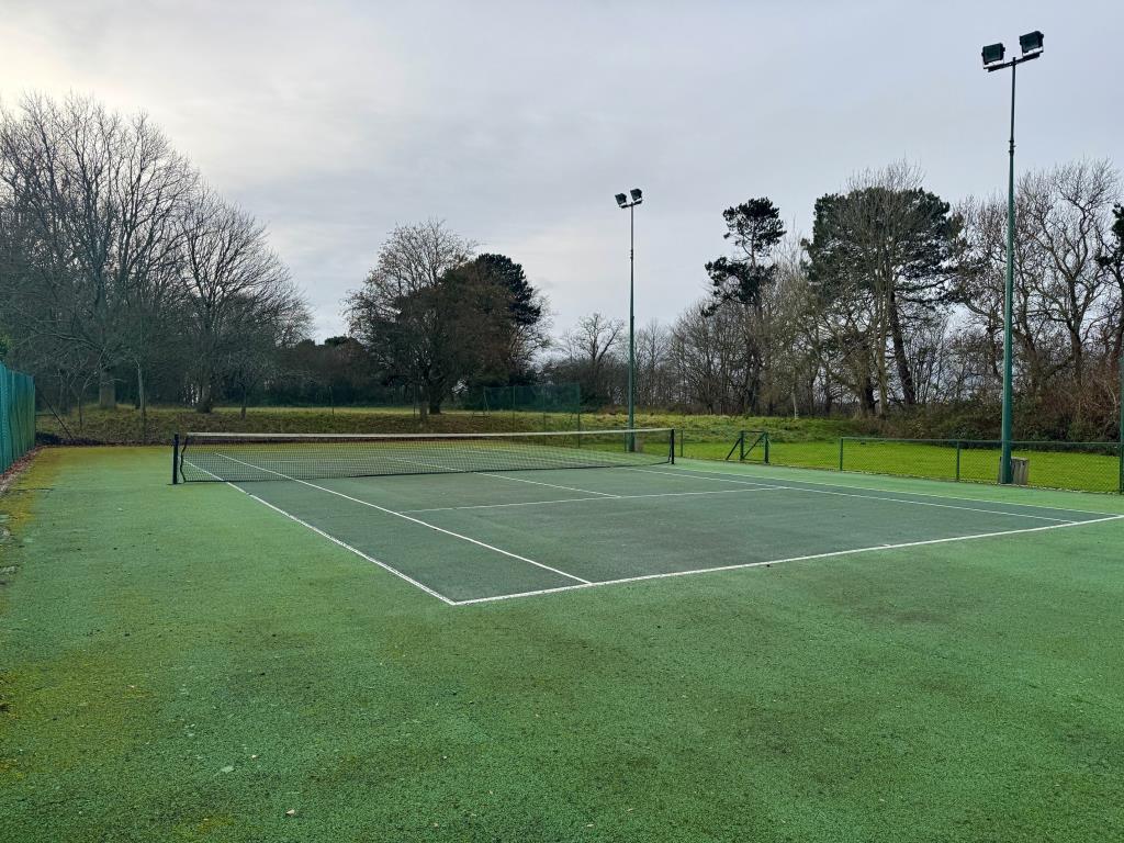 Lot: 43566 - COUNTRY ESTATE COMPRISING 5 BEDROOM MANOR HOUSE, WEDDING VENUE WITH 7 BEDROOM HOUSE, 6 ECO LODGES, 5 COTTAGES, 2 TENNIS COURTS, WORKSHOP AND ANCILLARY ACCOMMODATION - SET IN OVER 20 ACRES - Outside tennis court-inside the court